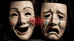 Duas máscaras teatrais conectadas por um fio vermelho, simbolizando a repetição de padrões inconscientes nos relacionamentos amorosos.